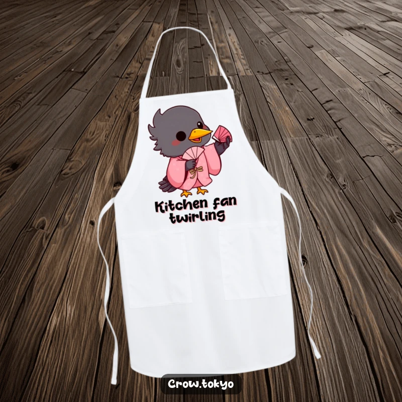 Funny kitchen apron showing a playful crow in a pink kimono, balancing a small fan on its beak.