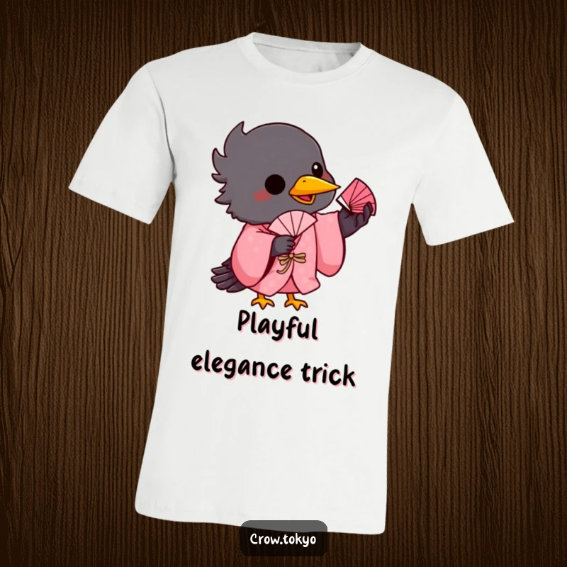 Funny t-shirt print of a mischievous crow in a pink kimono, balancing a tiny fan on its beak with concentration.